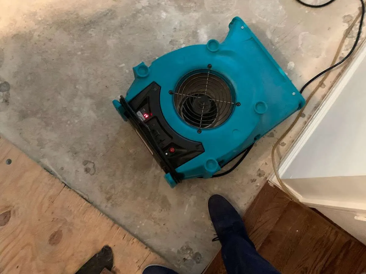 Air mover drying subfloor during Leak Detection & Repair in Swampscott